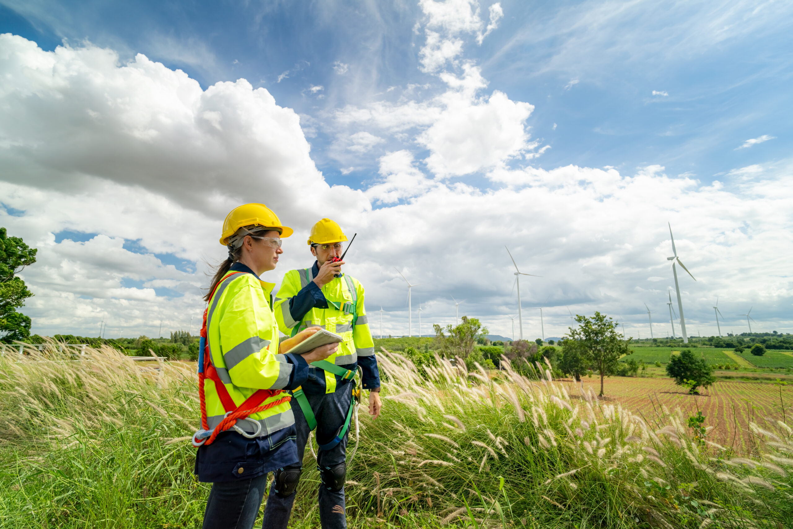 Tachnicians at construction site of wind turbine checking and maintanance Electricity wind generator.