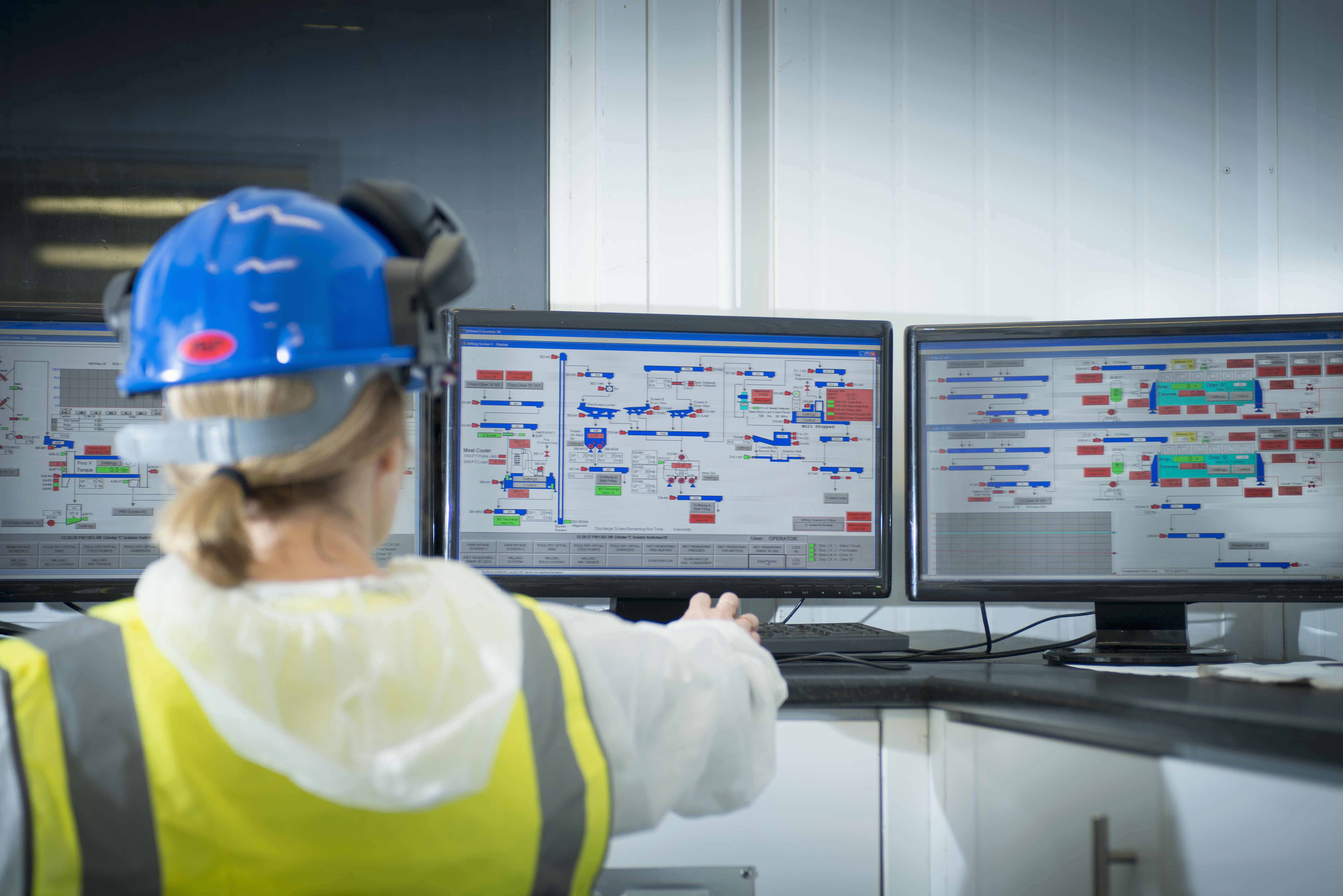 Professional at work monitoring system controls.
