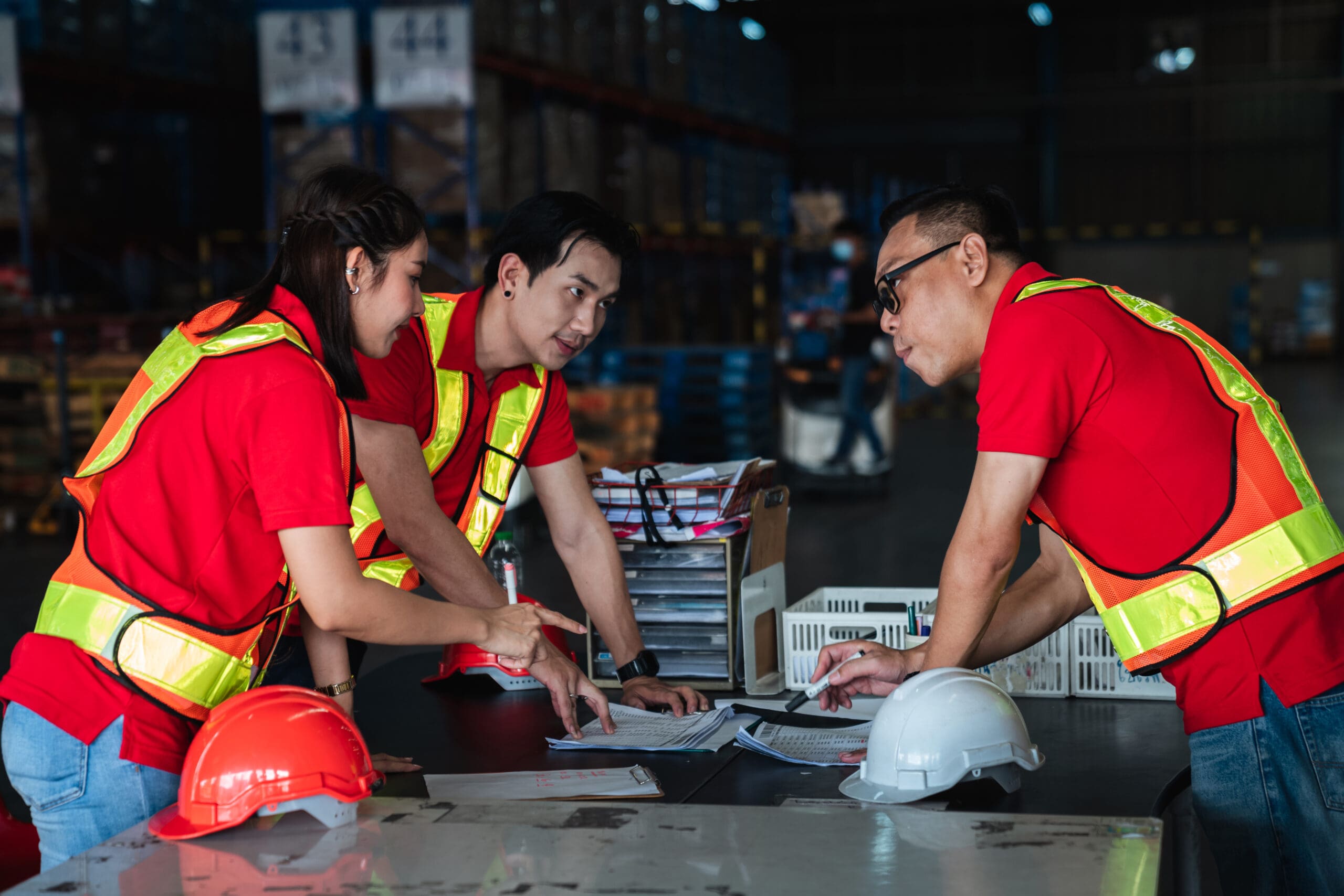Group warehouse workers meeting details about work in the warehouse., Industrial and industrial concept.